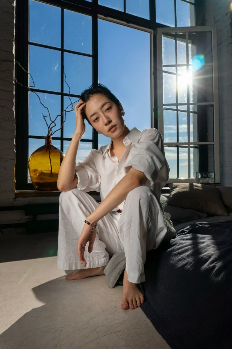 Woman by a window in daylight